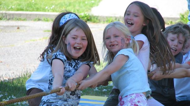 Children playing tug-of-war at Blakely School